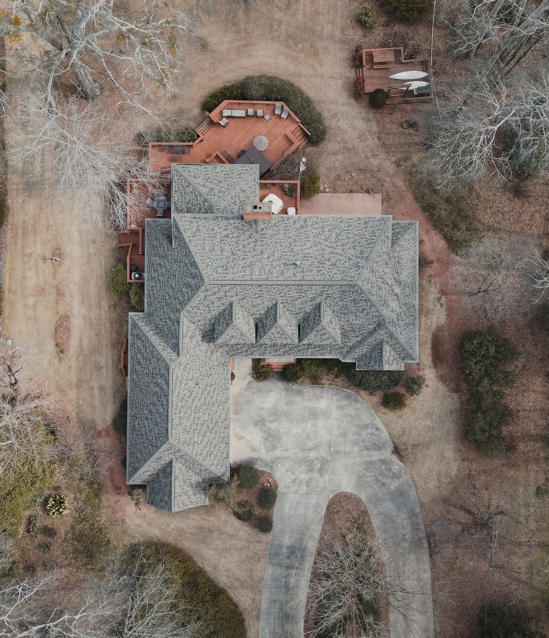 Top-down aerial of a finished roof with copper valleys