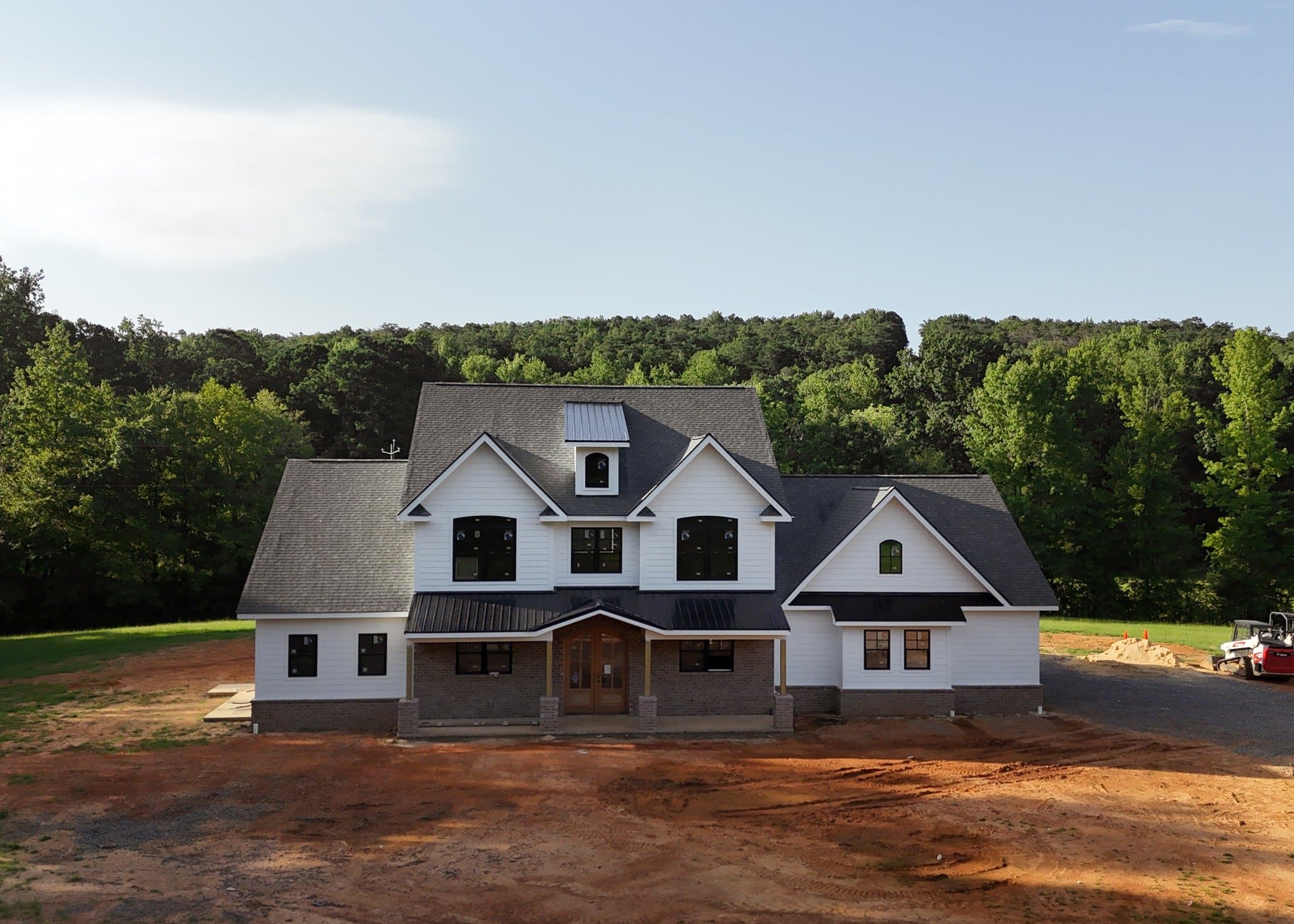 Home with vinyl and exterior rock siding